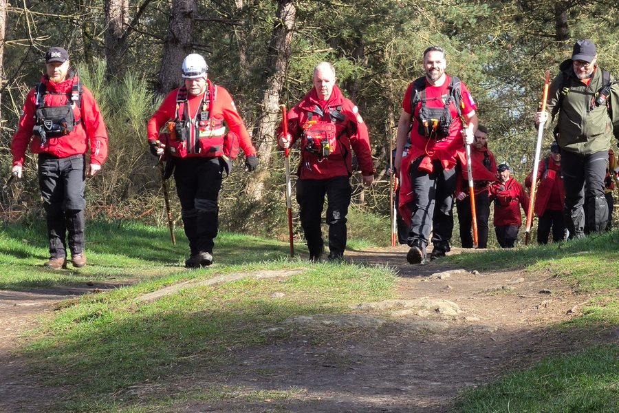 A WMSAR search team on a woodland track